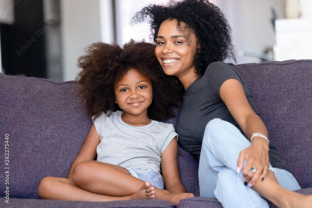 Head shot portrait happy African American mother with daughter Head shot portrait happy African American mother with daughter