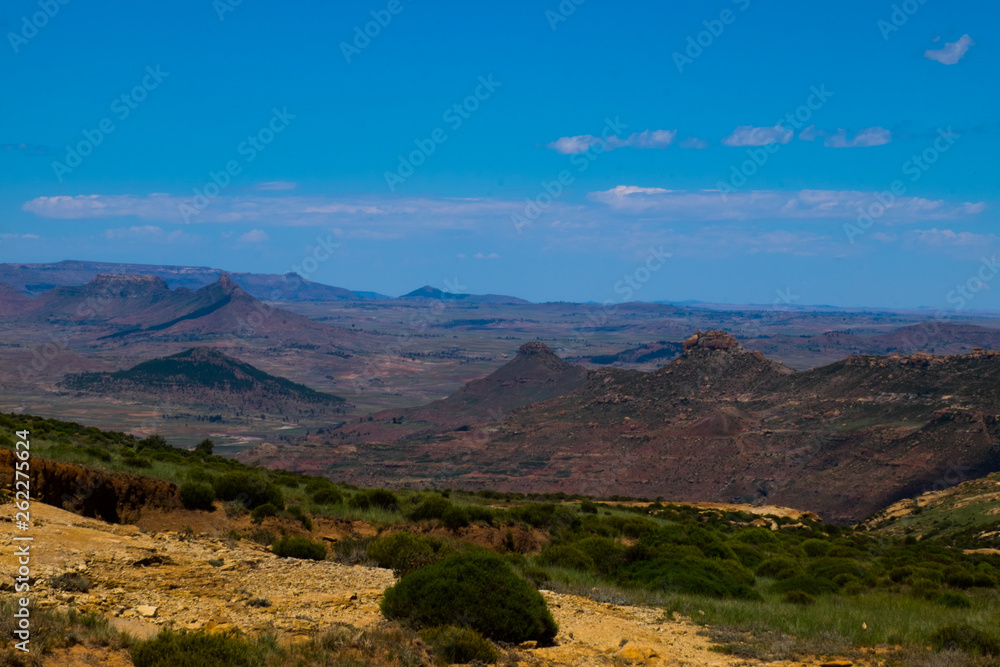 Open African landscape during day time with mountains and clouds, Lesotho