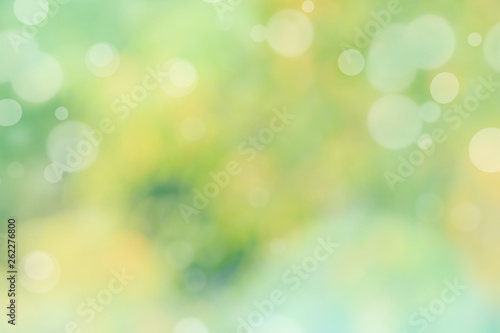 Abstract defocused nature background with green and yellow bokeh