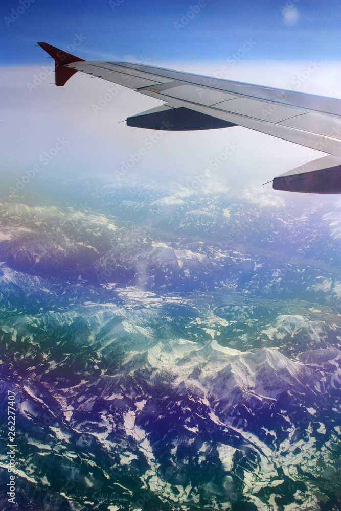 View of the Alps from the window of the plane