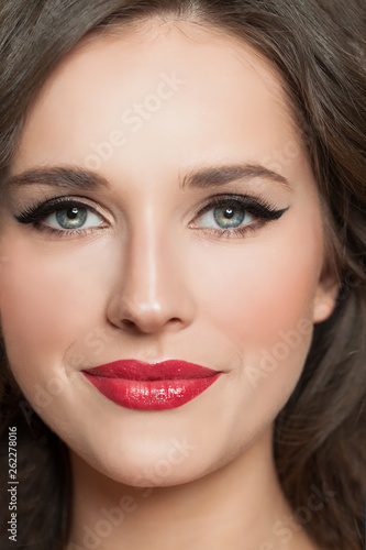 Young woman face with makeup closeup portrait