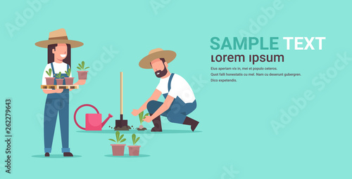couple farmers planting young seedlings plants flowers and vegetables man woman working in garden agricultural workers eco farming concept flat full length copy space horizontal