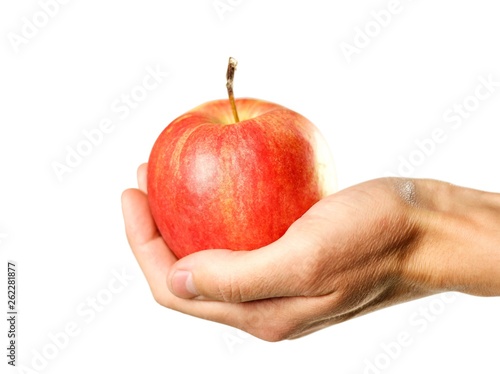 Hand holding a red apple. Close up. Isolated on white background