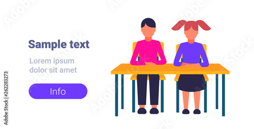 couple pupils sitting desk during lesson education concept elementary school schoolboy with schoolgirl full length flat horizontal copy space