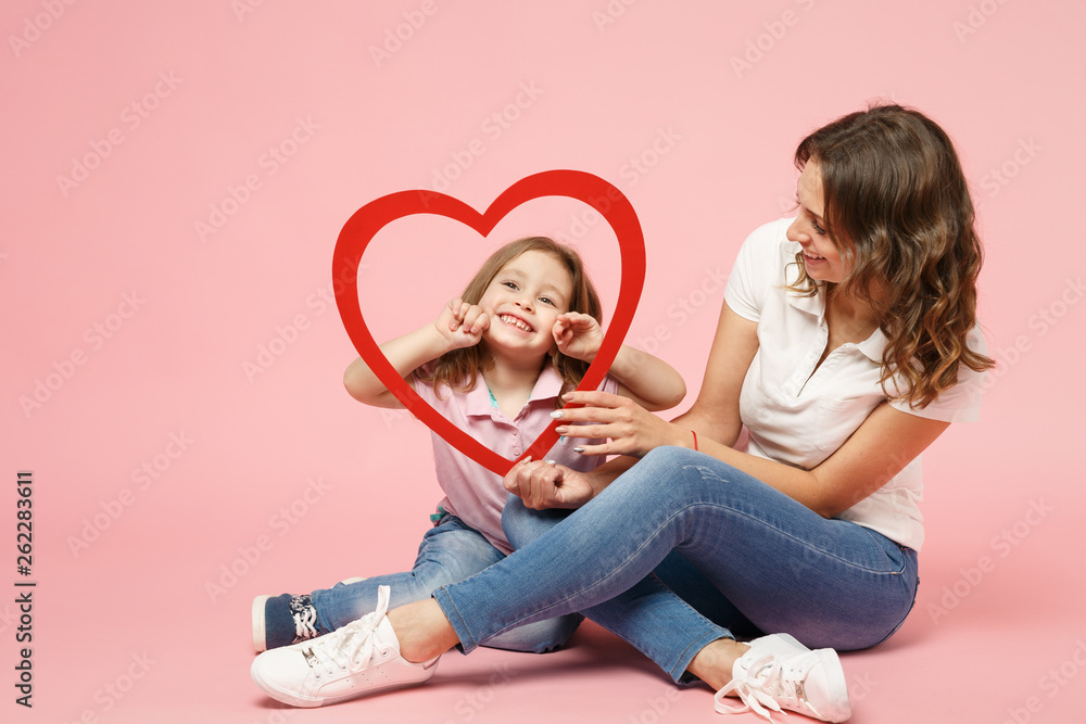 Woman in light clothes have fun with cute child baby girl. Mother, little kid daughter isolated on pastel pink wall background, studio portrait. Mother's Day, love family, parenthood childhood concept Woman in light clothes have fun with cute child baby girl. Mother, little kid daughter isolated on pastel pink wall background, studio portrait. Mother's Day, love family, parenthood childhood concept