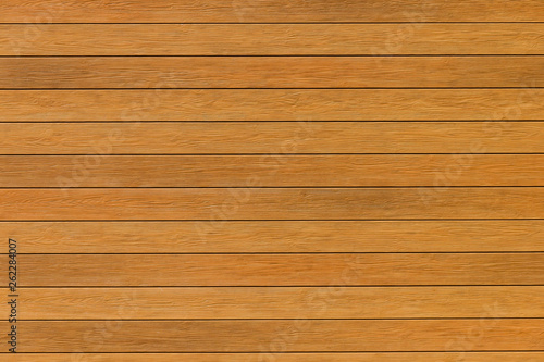close-up photo of wooden planks with warm yellow tones.