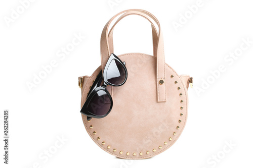 round female handbag and sunglasses