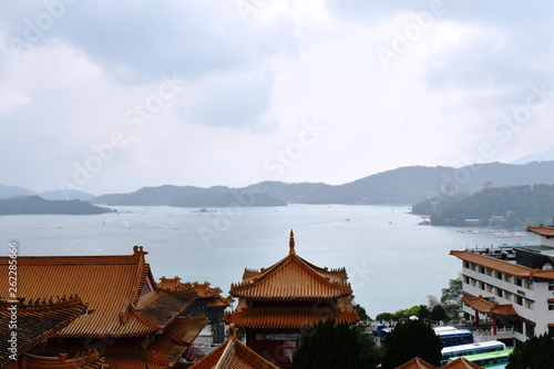 landscape of sun moon lake from tile roof of Xuanguang Temple in Taiwan