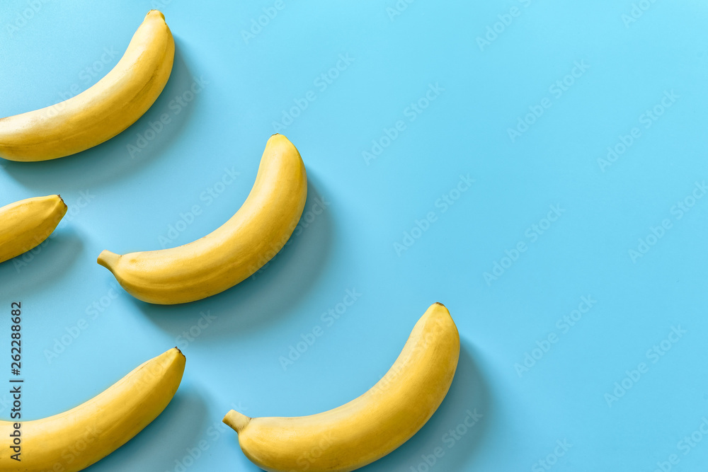 Five bananas on a blue pastel background. Minimal concept. Five bananas on a blue pastel background. Minimal concept.