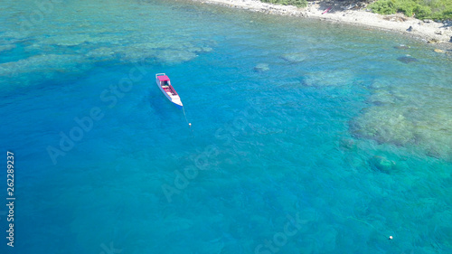 Traditional boat with Beautiful nature of blue sea sand and Turquoise color water waves at Atauro Island, Timor Leste