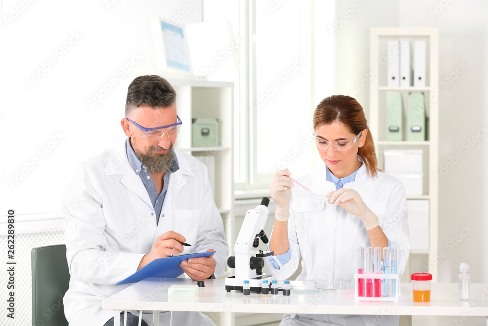 Scientists working in laboratory. Research and analysis Scientists working in laboratory. Research and analysis