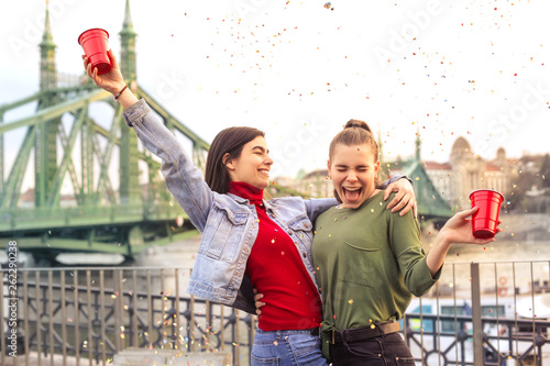 Photography Two girls having fun in a party on a terrace