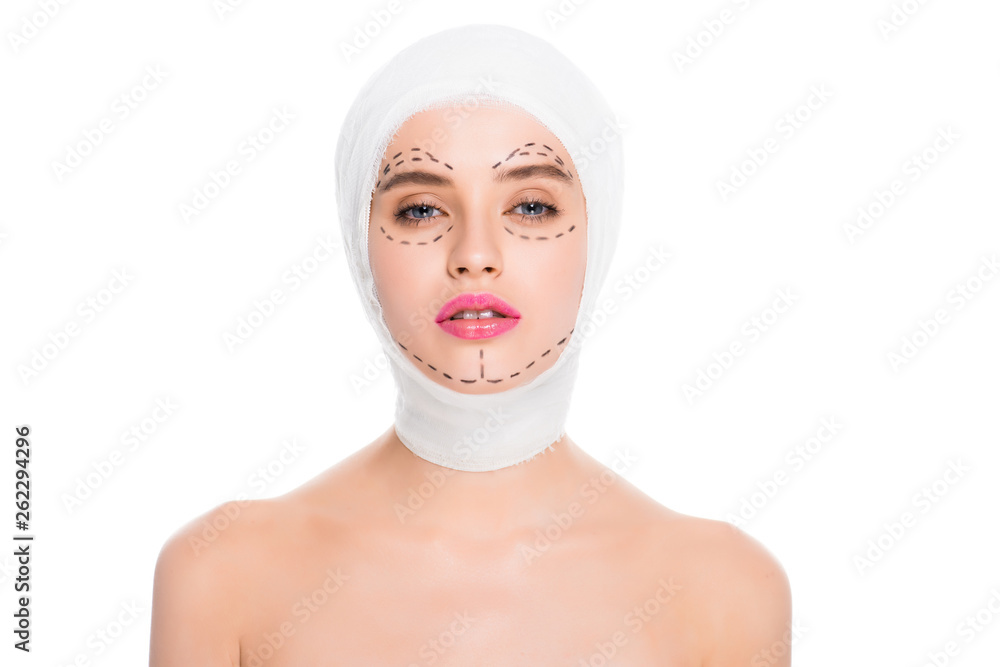attractive nude young woman with bandaged head and marks on face isolated on white attractive nude young woman with bandaged head and marks on face isolated on white