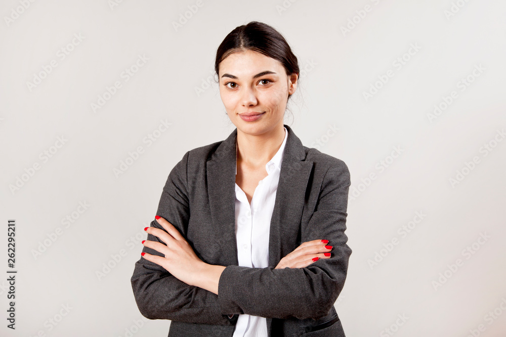Portrait of businesswoman on grey background. Portrait of businesswoman on grey background.