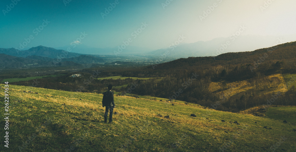 man on top of hill