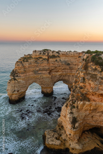 Amazing seascape at sunset at Marinha Beach in the Algarve, Portugal. Landscape with strong colors of one of the main holiday destinations in europe. Summer tourist attraction. © aroxopt