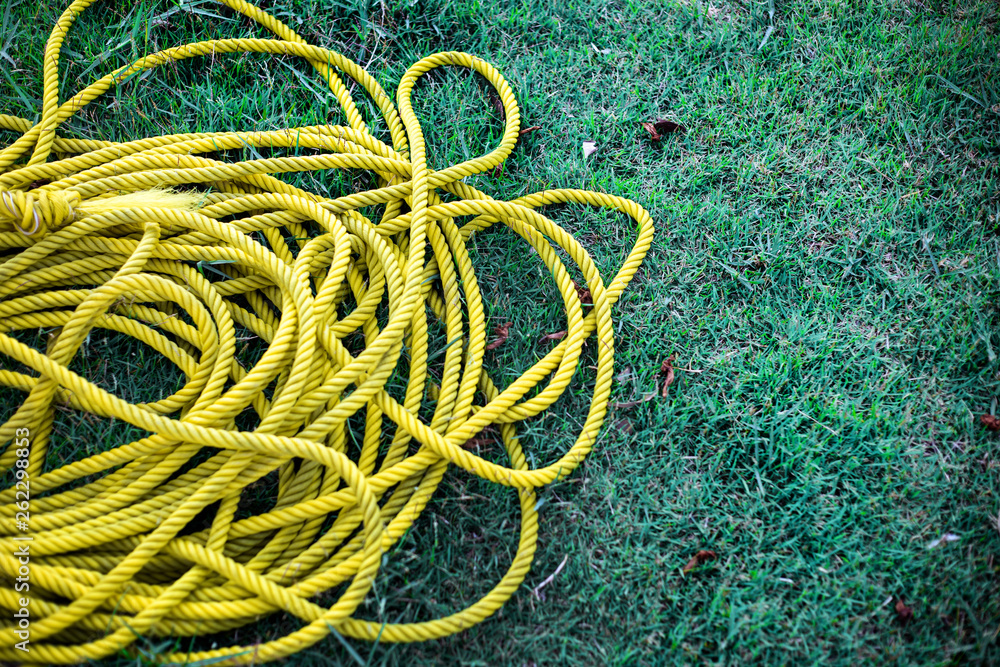 yellow nylon rope on green grass yellow nylon rope on green grass