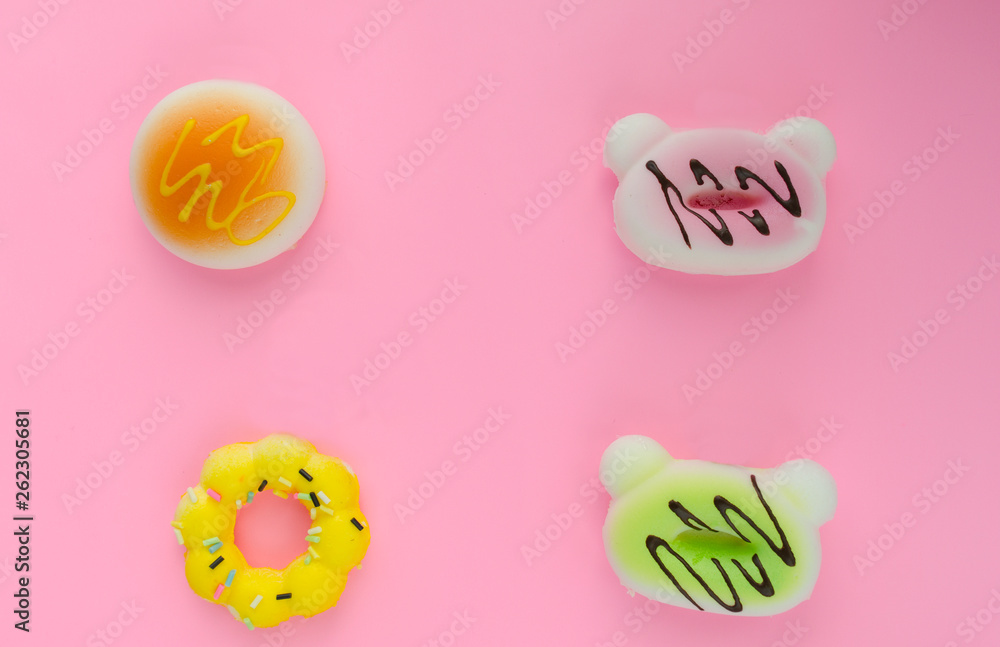fake donuts on a pink isolated background. For background lettering