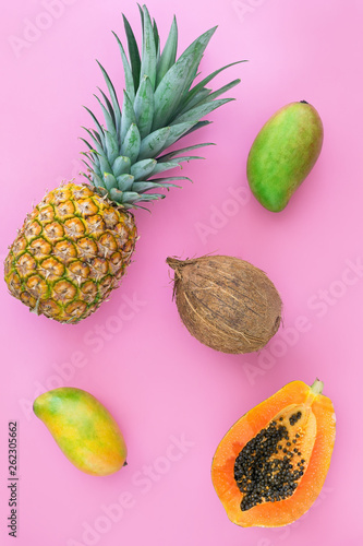 Pineapple, papaya, and mango flat lay.