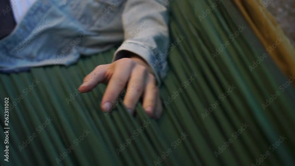 the guy's hand is on the cloth