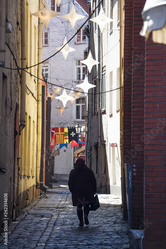 street in Riga old town with walking women. © Ed.Siau