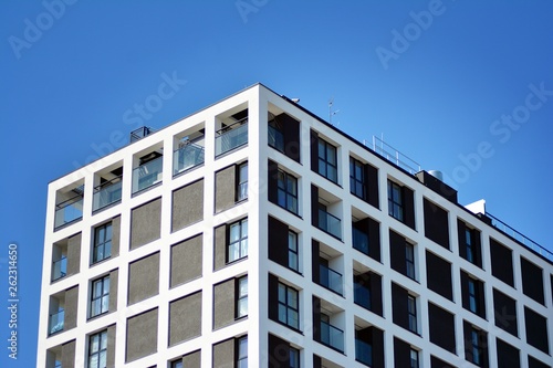 Modern apartment buildings on a sunny day with a blue sky. Facade of a modern apartment building