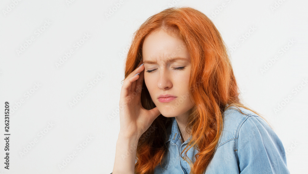 Young hopeless red hair woman suffering from depression having nervous breakdown holding her head on isolated background, copy space, female migraine Young hopeless red hair woman suffering from depression having nervous breakdown holding her head on isolated background, copy space, female migraine
