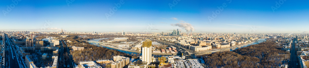 Fototapeta premium Moscow panorama and Leninsky Avenue with Monument to Yuri Gagarin on a winter day. top view of the avenue and car traffic.