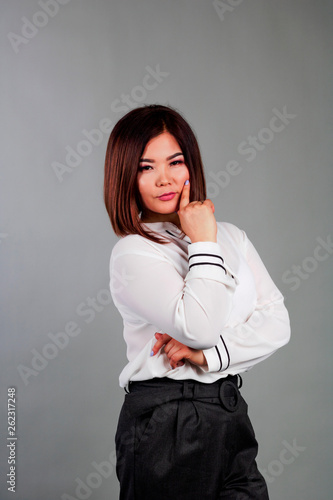 Beautiful Asian on a gray background.