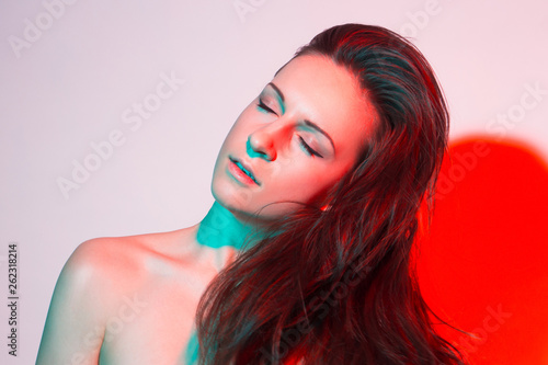 Neon portrait of young prety girl in red and green
