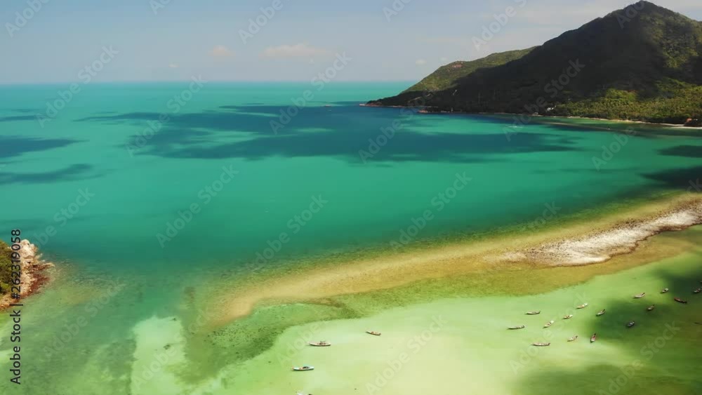 Aerial drone view island Koh Phangan Thailand. Exotic coast panoramic landscape, Chaloklum Malibu fisherman beach, summer day. Sandy path, corals. Vivid seascape, mountain coconut palms from above Aerial drone view island Koh Phangan Thailand. Exotic coast panoramic landscape, Chaloklum Malibu fisherman beach, summer day. Sandy path, corals. Vivid seascape, mountain coconut palms from above