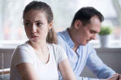 Millennial couple after fight at home ignoring each other