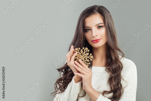Beautiful woman with snowflake. Christmas and New Year concept