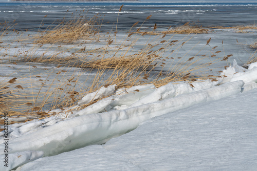 seascape sea covered with broken ice on a Sunny spring day.beautiful natural background photo