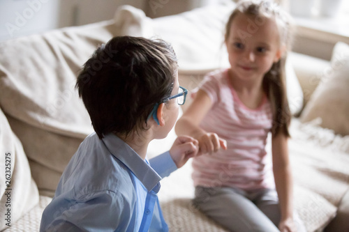 Photos Brother and sister squeeze little fingers as sign of reconciliation