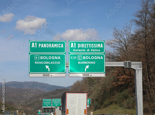 italian traffic signs with two roads Panoramica or Direttissima photo