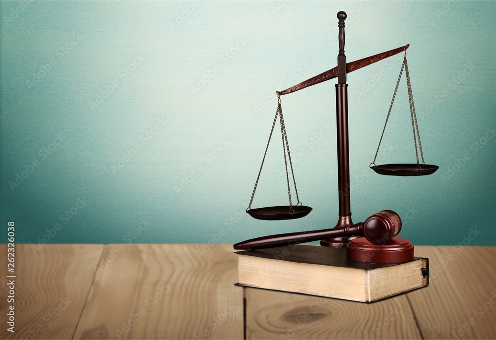 Justice Scales and books and wooden gavel