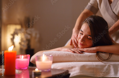 Girl on massage in the spa salon.