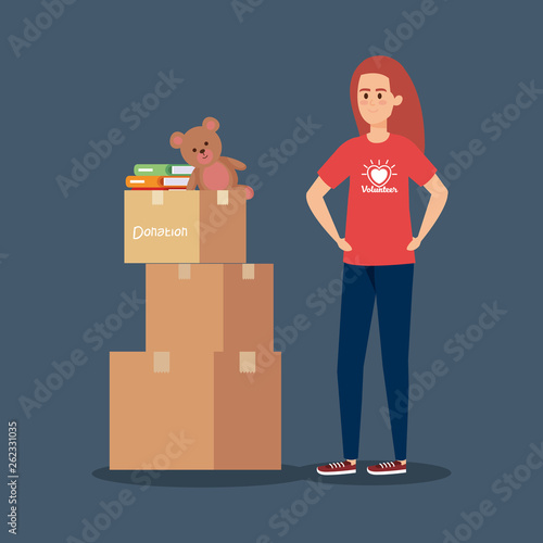 girl volunteer with boxes and books with teddy