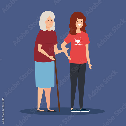 girl volunteer with old woman to donation