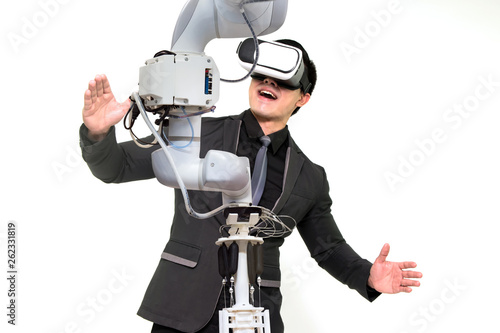 Virtual reality technology in industry 4.0. Business man suit wearing VR glasses to see AR service , Thermal Monitoring motor for check destroy part of smart robot arm machine  on white background.