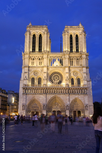 Notre Dame cathedral front in the early evening blue hours, Paris, France