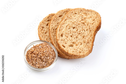 Slices of wheat bread and bran, healthy organic food, fitness, close-up, isolated on white background