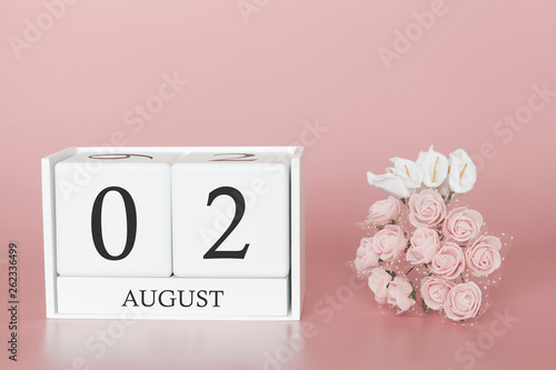 August 02nd. Day 2 of month. Calendar cube on modern pink background, concept of bussines and an importent event. photo