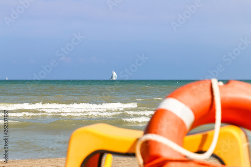 View from shore to sailing boats far to the sea, Italy, Riccione