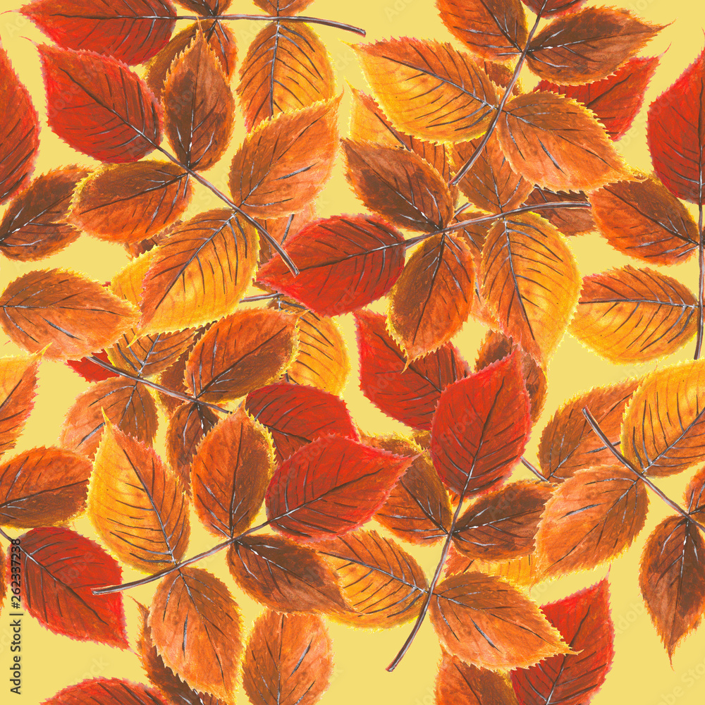 Yellow-red autumn leaves on pale-yellow background