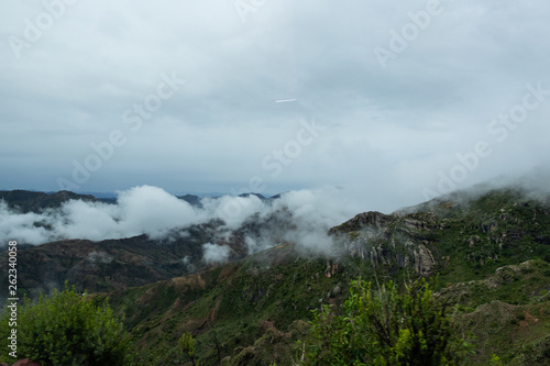 Landscape in Bolivia formed by mountains and white clouds