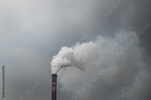 Dirty smoke from industrial chimneys or factory pipe