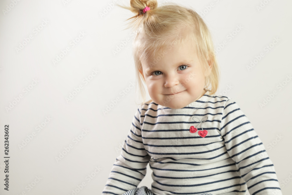 Studio portrait of adorable blonde smiling baby girl Studio portrait of adorable blonde smiling baby girl