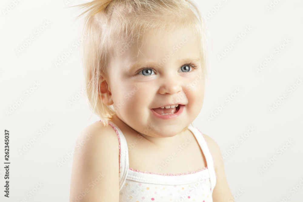 Studio portrait of adorable blonde smiling baby girl Studio portrait of adorable blonde smiling baby girl
